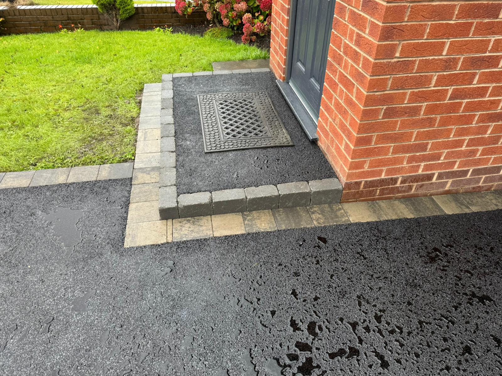 Tarmac doorstep and driveway with decorative block paving border